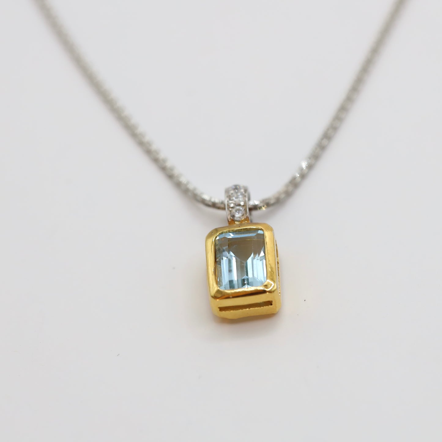 sky blue topaz pendant with 9k gold and silver 925