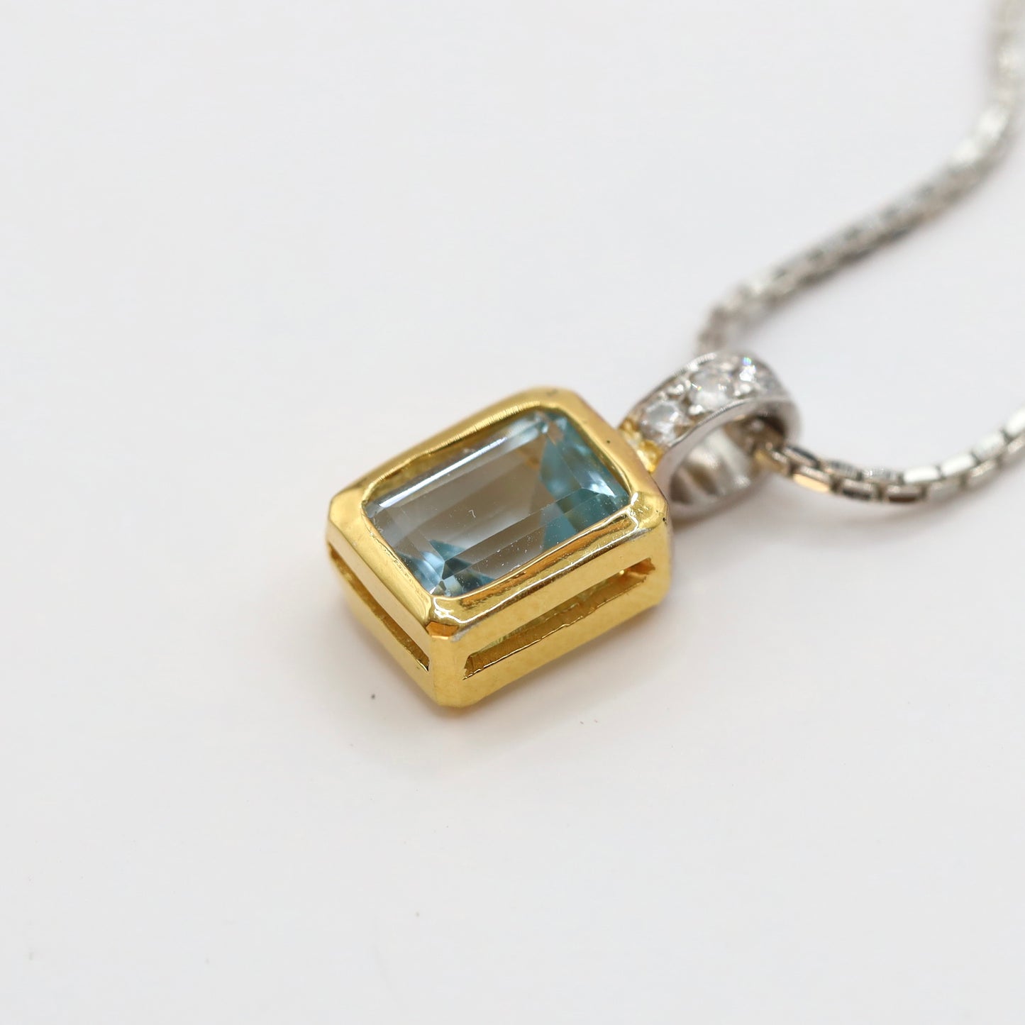 sky blue topaz pendant with 9k gold and silver 925