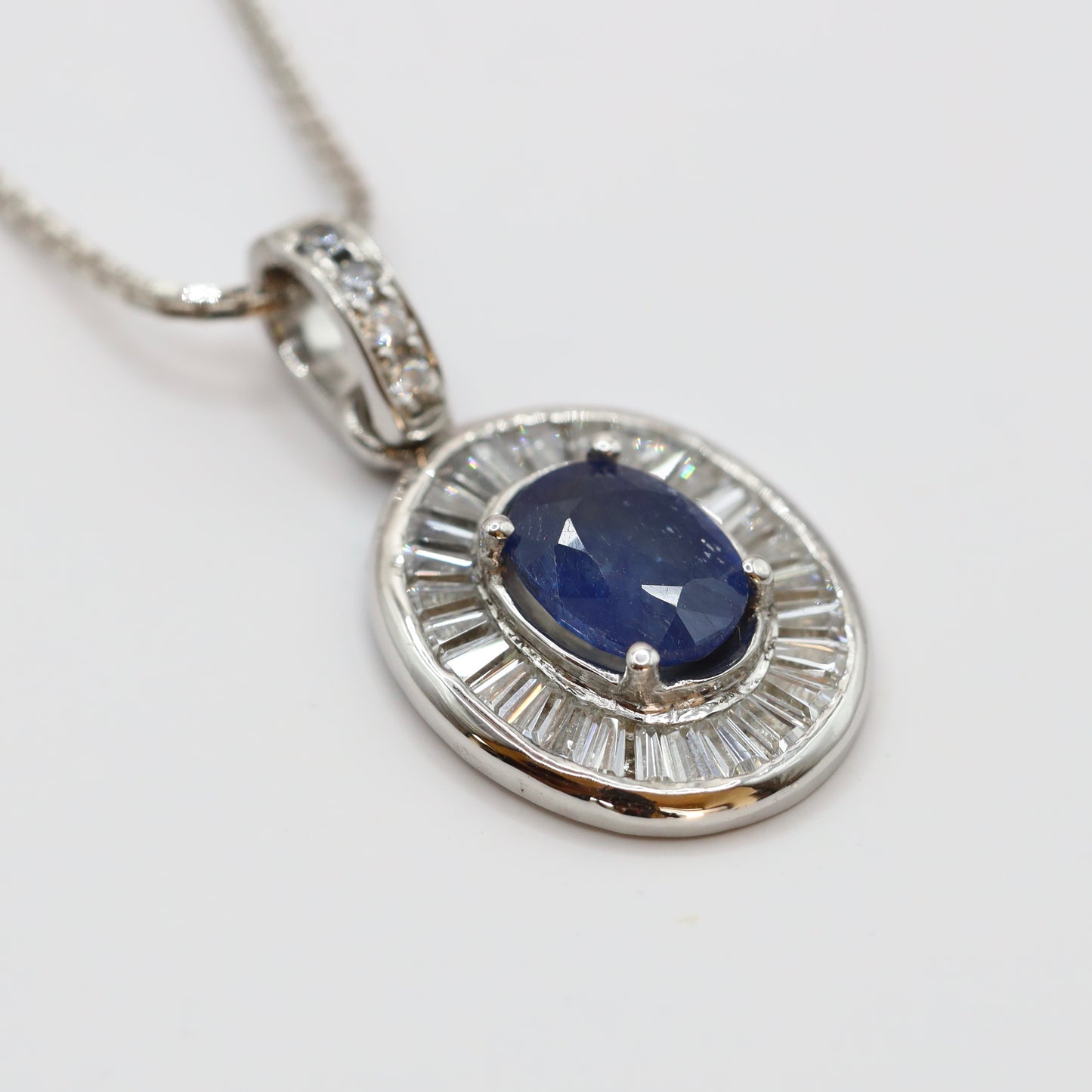 handmade 925 silver pendant with blue sapphire and tapered baguette cubic zirconia