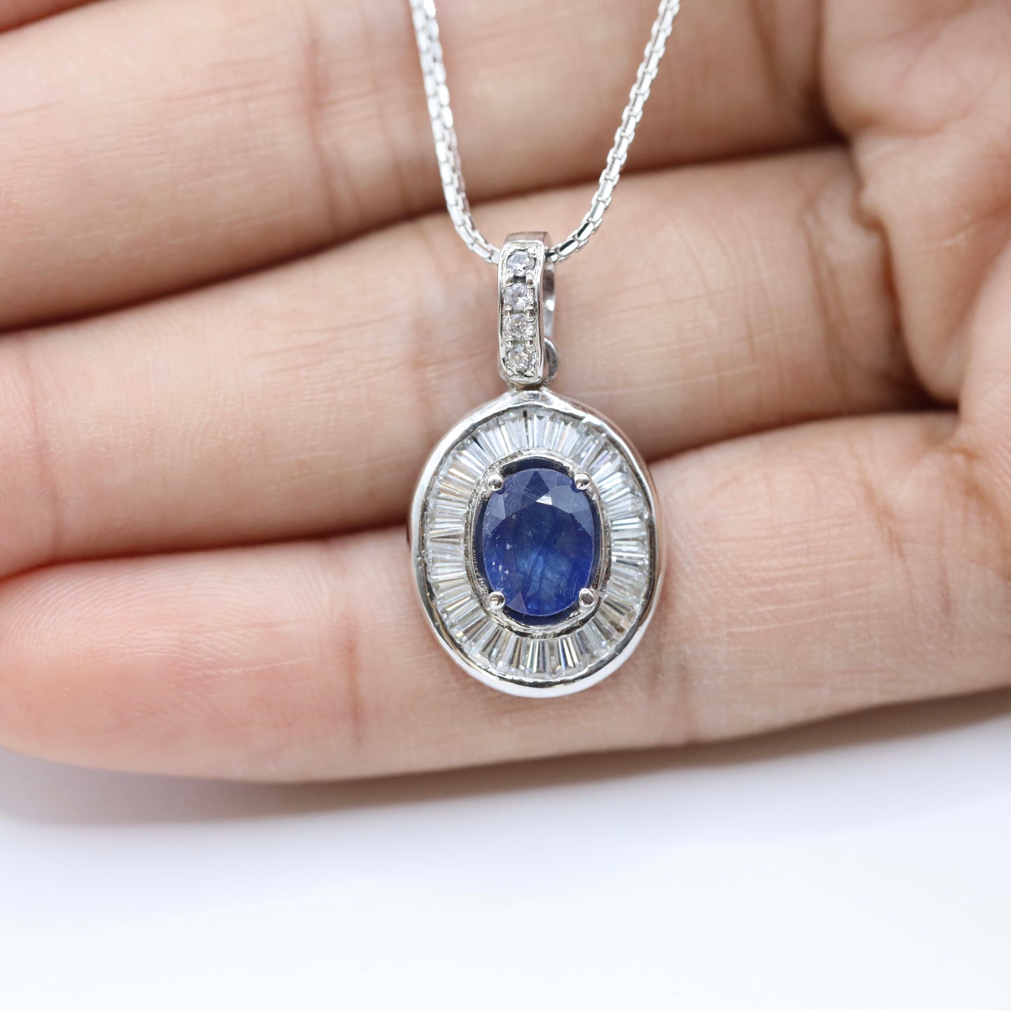 handmade 925 silver pendant with blue sapphire and tapered baguette cubic zirconia