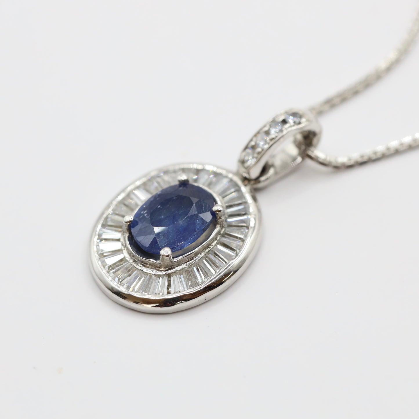 handmade 925 silver pendant with blue sapphire and tapered baguette cubic zirconia